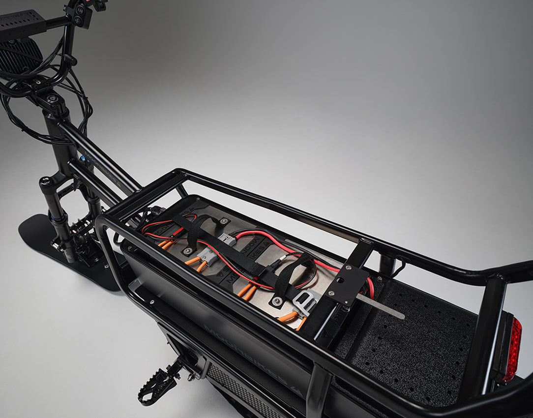 The Silent Electric compact Snowmobile Alternative, electric snow scooter, battery-powered snowmobile, electric winter bike, quiet winter vehicle